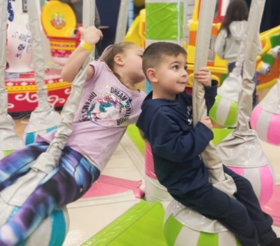 Kids Swinging of our Spinning Palm Tree at a kids party