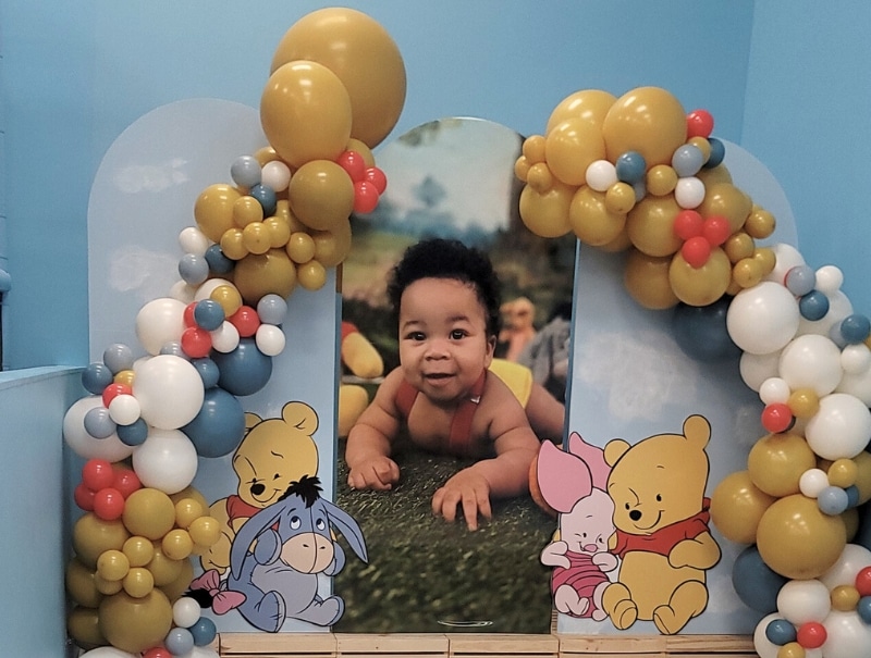 Photo on backdrop in kids party room with ball pit