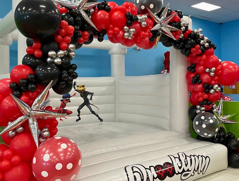 Cloud Nine Kids Party Bouncer Add-on decorated with a balloon garland